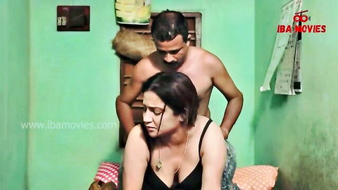 Busty Indian wife bent over bed as shirtless husband grips hips for rough doggy fuck