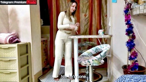 Clothed Russian amateur woman in tight white jumpsuit standing in kitchen saying no he's gone