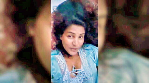 Blurry closeup of sexy Indian housewife in sheer blue lace lingerie showing cleavage