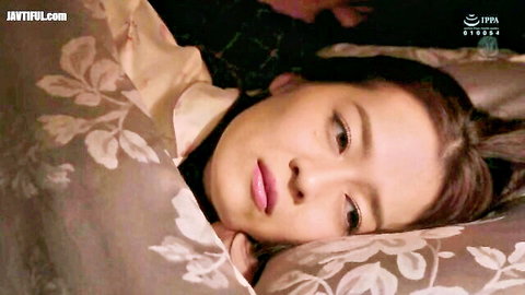 Fuji Kanna seductive pose in bed, Japanese JAV secretary scene