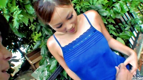 Cute Japanese girl in thin blue camisole smiles as boyfriend gropes her tits outdoors