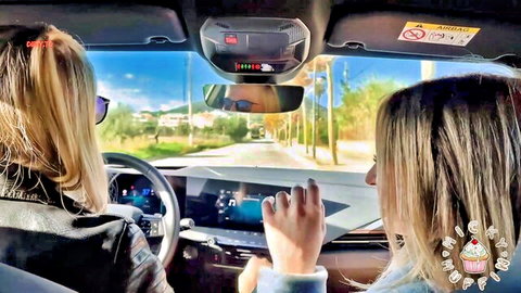 Blonde Micky Muffin driving car with friend on sunny road