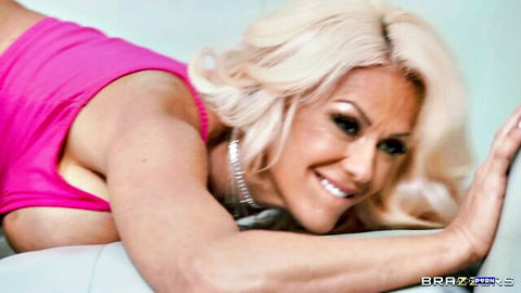 Taylor Vixxen blonde MILF in pink top, seductive cleavage pose