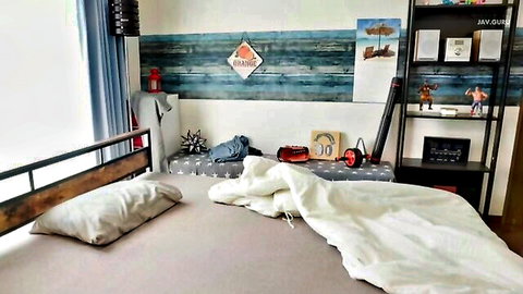 Empty messy bed in cozy kid's bedroom with toys bookshelves and JAV Guru branding
