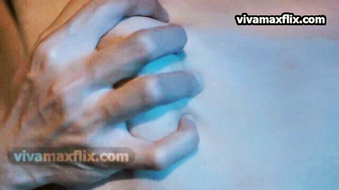 Man's hand tightly gripping glowing white orb in closeup