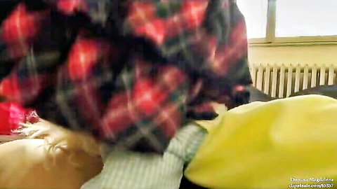 Domina Magdalena in open plaid shirt exposing skin on yellow bedding