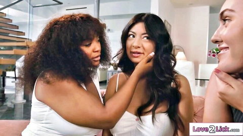 Black babe caresses Asian beauty's face while another watches in steamy threesome tease