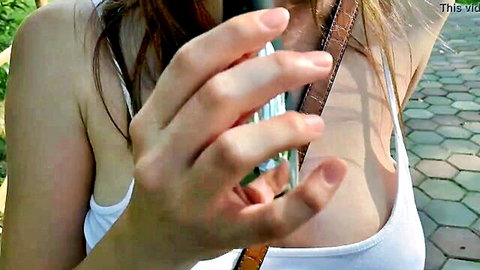 CreamySofy in park, teasing with cleavage in white tank top outdoors