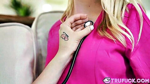 Blonde nurse Braylin Bailey in pink scrubs holding stethoscope to chest, medical roleplay tease