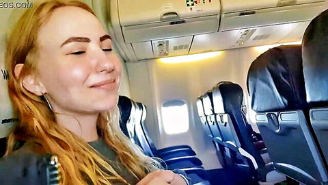 Bella Mur redhead on airplane, eyes closed smile, public handjob blowjob preview