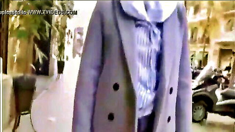 Veiled Egyptian woman in purple coat walking street, Antonio Suleiman video