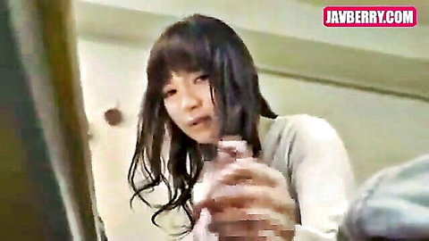 Japanese AV idol with long black hair and bangs in white blouse holding pink object, JAV teaser