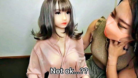 Japanese woman teases sex doll in open blouse for threesome handjob