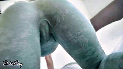 RubiRay bent over in tight green leggings with visible cameltoe
