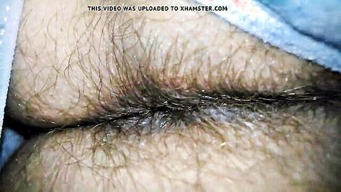 Close-up of wife's hairy ass cheeks spread in blue cloth, amateur view