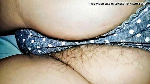 Close-up of hairy pussy and ass in polka dot panties pulled aside
