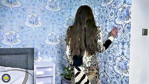 Mature mom in zebra print dress standing with long hair down her back