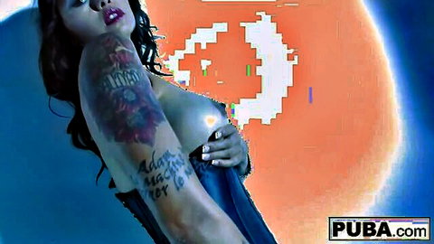 Dana Vespoli sexy MILF showing curves and tattoos in revealing top