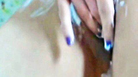 Blurry close-up of hands with blue nails on skin during intimate ex-girlfriend fuck