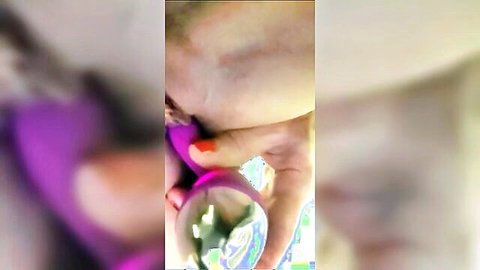 Blurry closeup of woman with red nails sucking purple dildo toy solo homemade