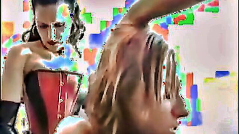 Dominant brunette in red corset with submissive blonde in lesbian strapon teaser