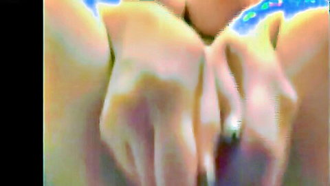 Close-up of sexy ex-girlfriend's large breasts cupped by hands, shiny skin