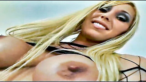 Mature blonde bombshell with massive tits in strappy black lingerie