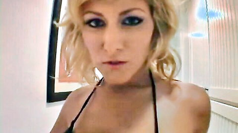 Velicity Von sexy blonde MILF close-up seductive pose in black halter top