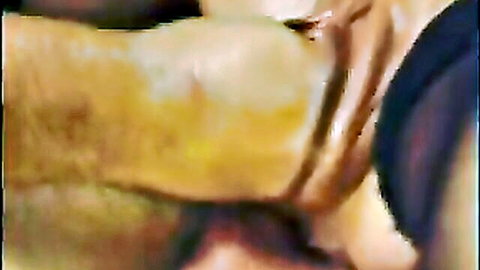 Thick hairy cock gripped firmly by hand in extreme close-up