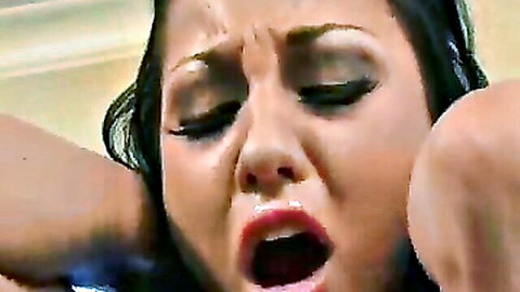 Close-up orgasm face of sexy brunette on Sybian, intense pleasure expression