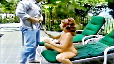 Nude brunette MILF sitting outdoors with standing man, anal preview