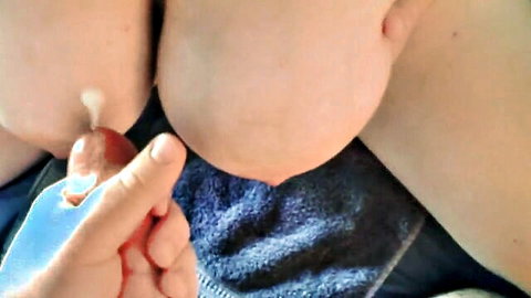 Close-up of lactating big tits with milk dripping, hand touching in cum fantasy