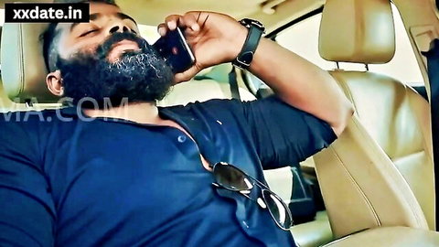 Bearded Indian man intimately close to dark-haired woman in blue top