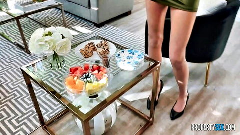 Addison Vodka in short green skirt and heels, teasing birthday setup