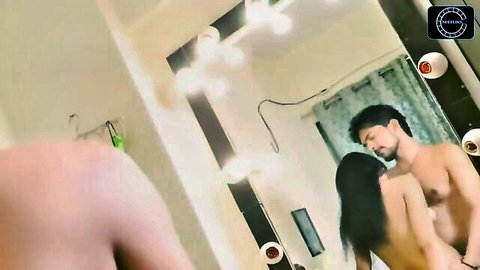 Nude Indian couple passionately embracing in intimate standing pose