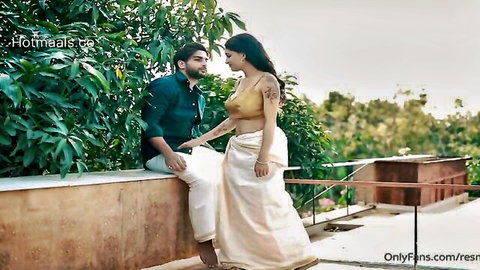 Ira F in steamy dhoti romance, embracing muscular hunk outdoors