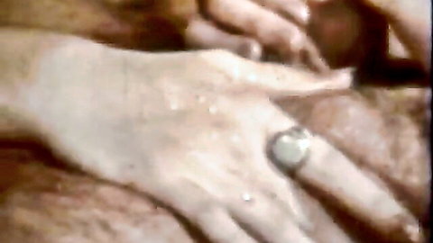 Vintage hand close-up with ring in classic anal erotica scene
