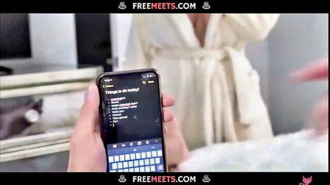 Natasha Nice exposes big tits in open white robe, holding phone teasing