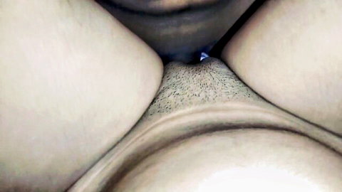 Close-up of Desi woman's hairy muff in solo fingering session
