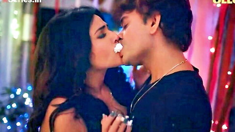 Passionate South Asian couple French kissing with open mouths and tongues touching