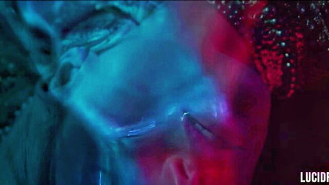 Ivy Wolfe intense neon-lit gaze in Void, blue red hues