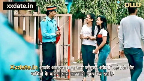 Indian policeman talking to two smiling young women in casual clothes outside gate in ULLU series