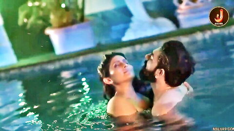 Indian couple passionate topless embrace in pool sex scene