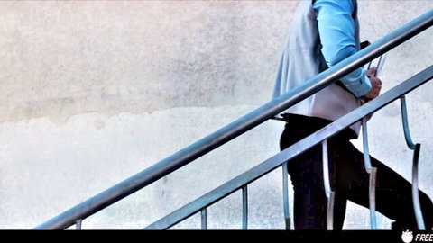 Tommy Gold in casual blue shirt and black pants on stairs, from Lia Lin threesome