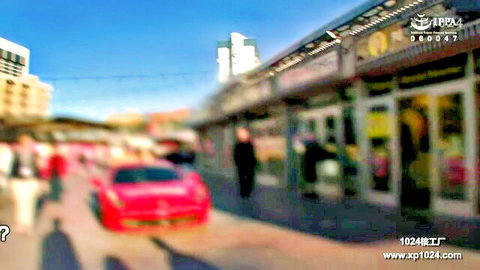 Blurry outdoor scene with Asian woman in black dress near red Ferrari on urban street