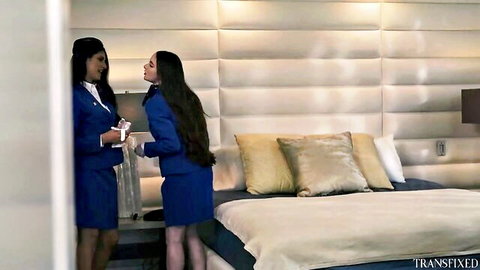 Hazel Moore in flight attendant uniform with partner in bedroom scene