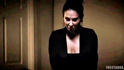Intense brunette in black dress with cleavage, widow theme