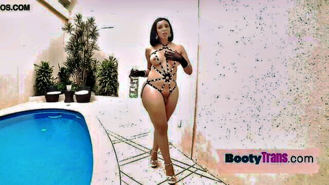 Curvy Latin trans beauty in skimpy swimsuit poses by pool, big booty tease
