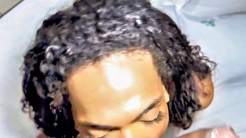 Curly-haired trans beauty eagerly performs deep blowjob, thirsty for milk satisfaction