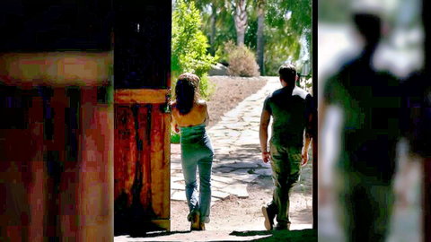 Young brunette teen in tight jeans showing small ass walking away outdoors with guy